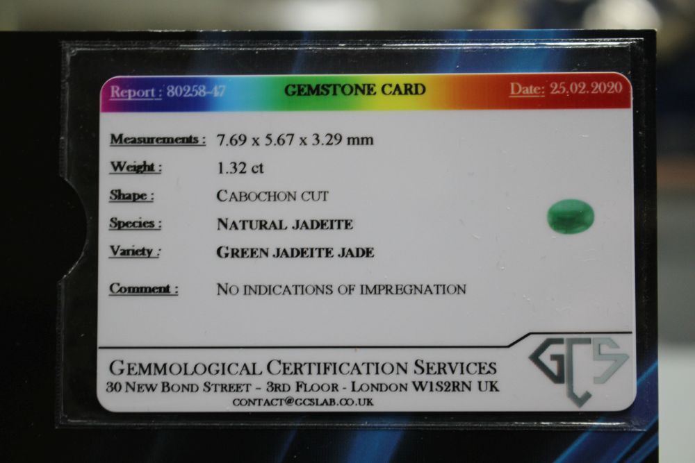 An unmounted cabochon cut jadeite stone, with GCS certificate dated 25/02/20